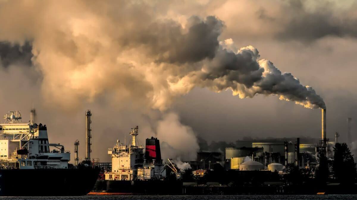 Smog and air pollution over a Texas city skyline — the kind of outdoor air contamination that makes whole-home indoor air filtration essential for Central Texas homeowners with allergies or respiratory sensitivity.